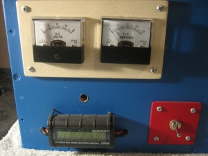 Volt meter, Amp meter, power monitor and on/off switch.